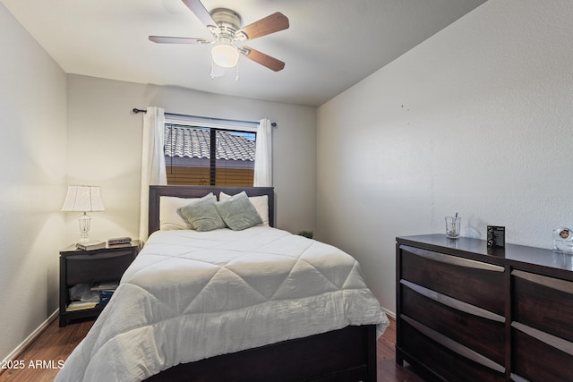 3534 N 106th Ln, Avondale, AZ 85392 - bedroom with dark wood finished floors and ceiling fan