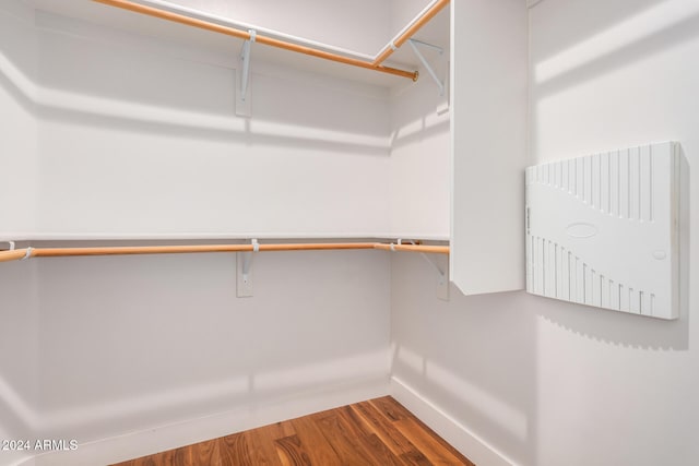 walk in closet featuring hardwood / wood-style floors