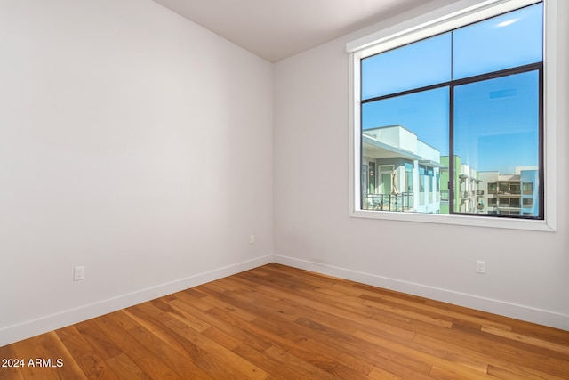 unfurnished room featuring hardwood / wood-style floors