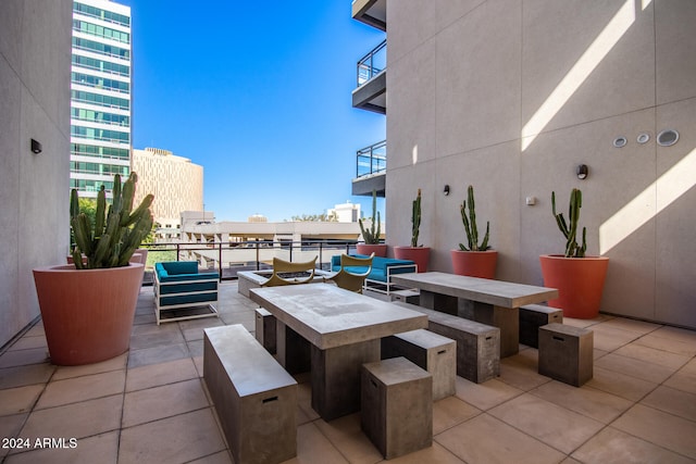 view of patio / terrace with an outdoor hangout area and a balcony