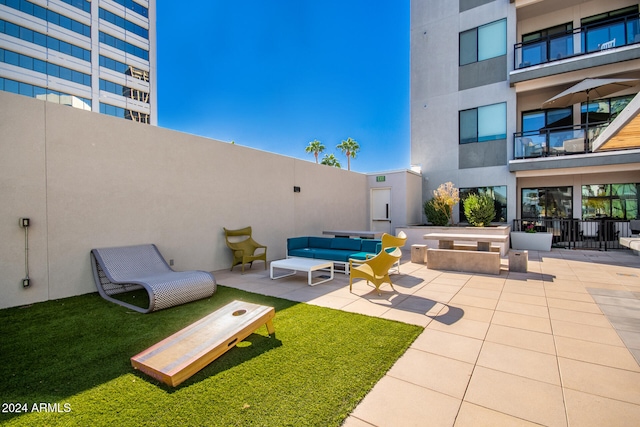 view of patio / terrace with a balcony and an outdoor hangout area