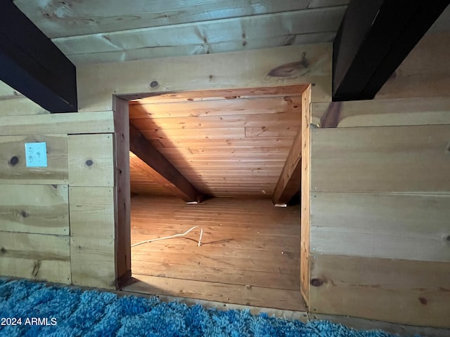 interior space with wooden walls and wood ceiling