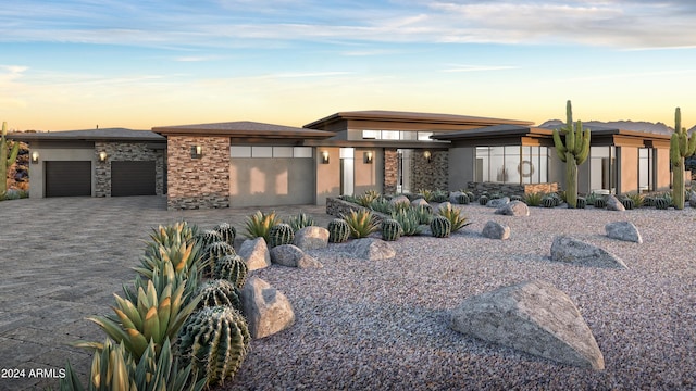 prairie-style home with a garage