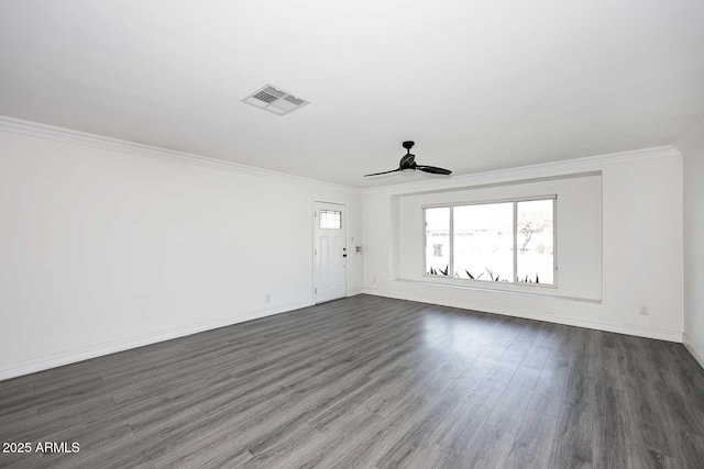 empty room with ceiling fan, ornamental molding, and dark hardwood / wood-style floors