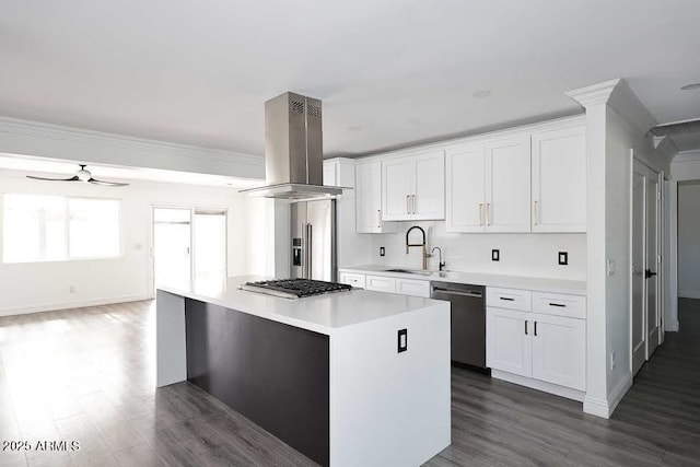 kitchen featuring sink, a center island, appliances with stainless steel finishes, island exhaust hood, and white cabinets