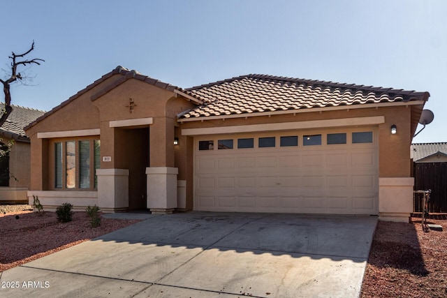 mediterranean / spanish home featuring a garage