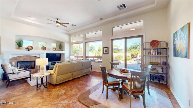 dining room featuring a tray ceiling and ceiling fan