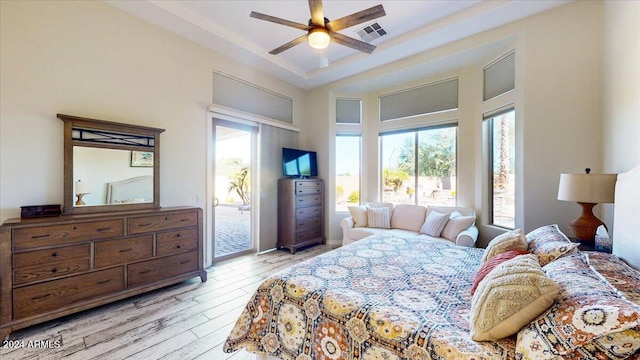 bedroom featuring ceiling fan, access to outside, and light wood-type flooring