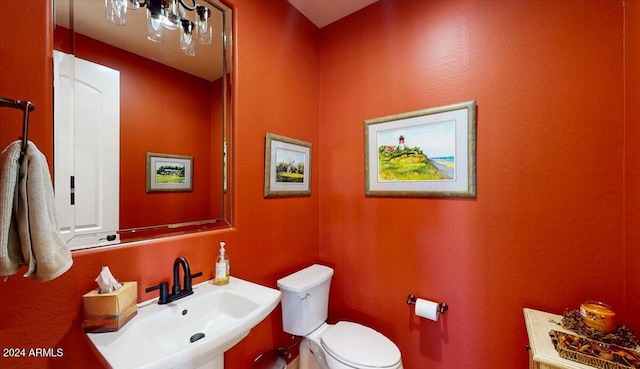 bathroom with sink and toilet