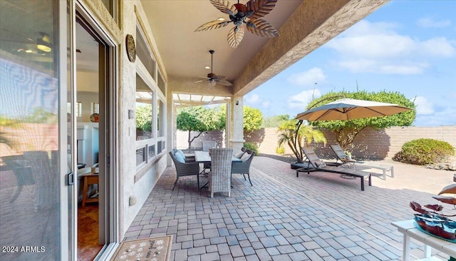 view of patio featuring ceiling fan