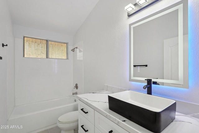 bathroom featuring toilet, shower / washtub combination, and vanity