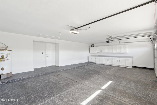 garage featuring a garage door opener, water heater, and baseboards