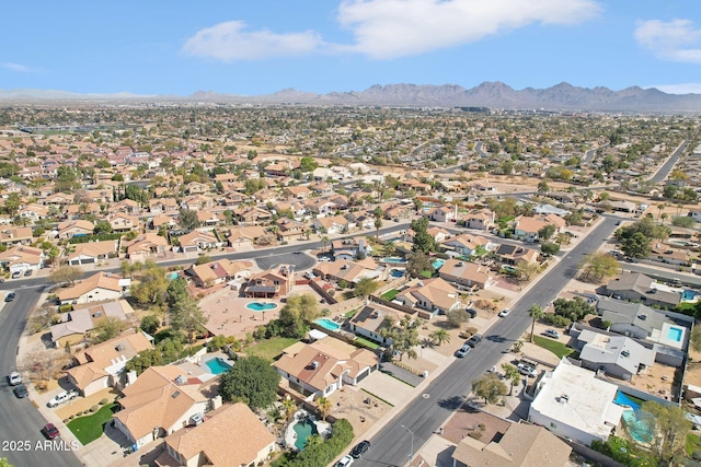 bird's eye view with a residential view and a mountain view