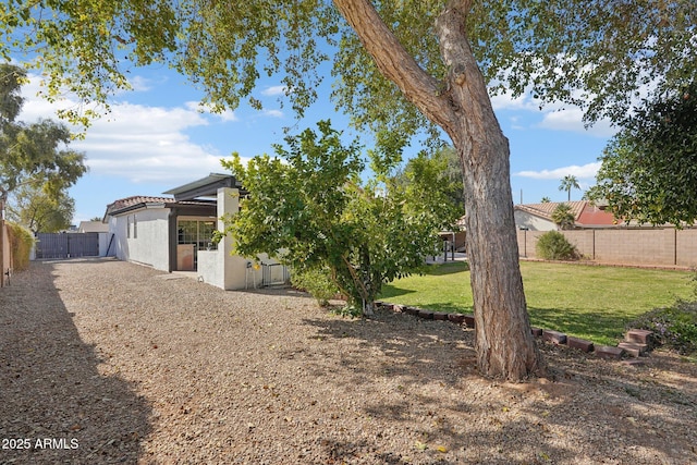 view of yard featuring a fenced backyard