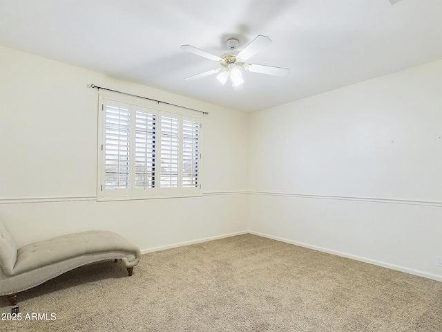 living area featuring carpet flooring and ceiling fan