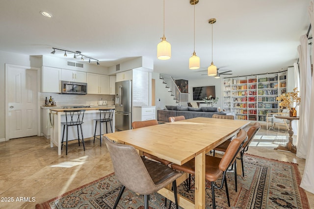 dining area featuring ceiling fan