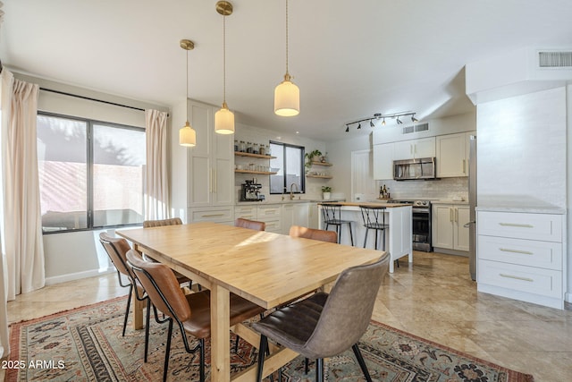 dining room featuring sink