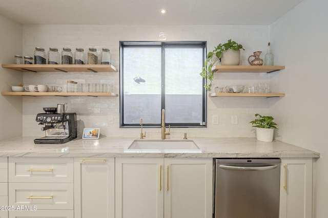 bar featuring dishwasher, light stone counters, decorative backsplash, sink, and white cabinetry