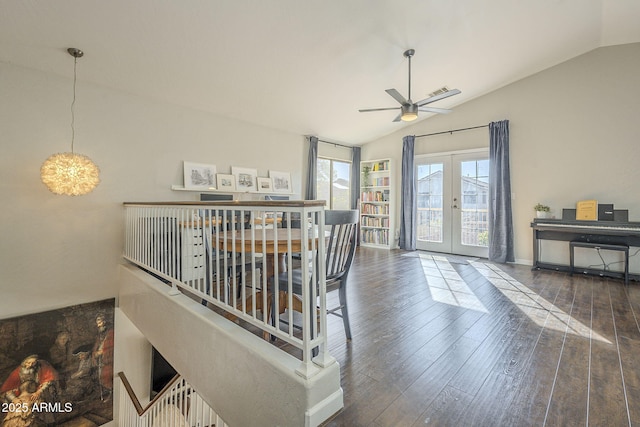 dining area featuring lofted ceiling, ceiling fan, french doors, and dark hardwood / wood-style flooring