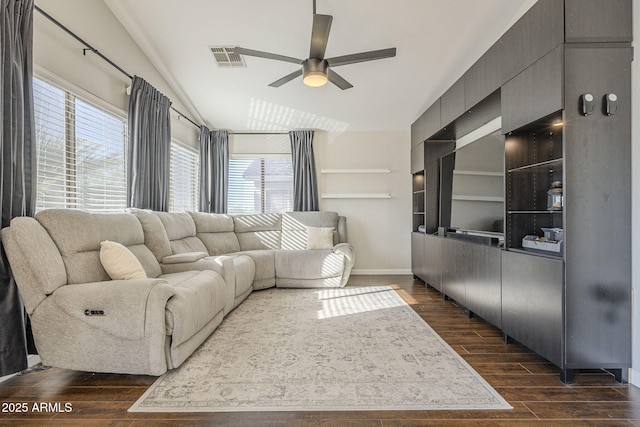 living room with ceiling fan and a wealth of natural light