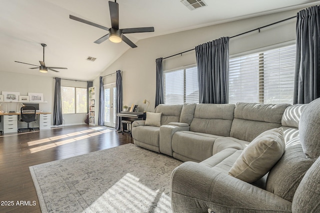 living room featuring dark hardwood / wood-style flooring, ceiling fan, and vaulted ceiling