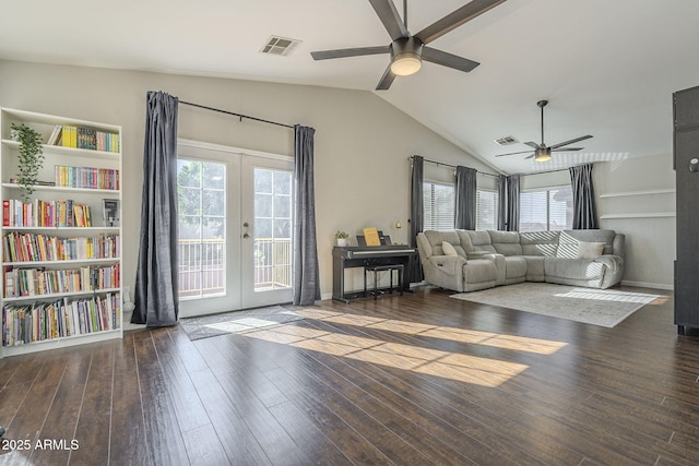 living room with ceiling fan, french doors, vaulted ceiling, and dark hardwood / wood-style floors