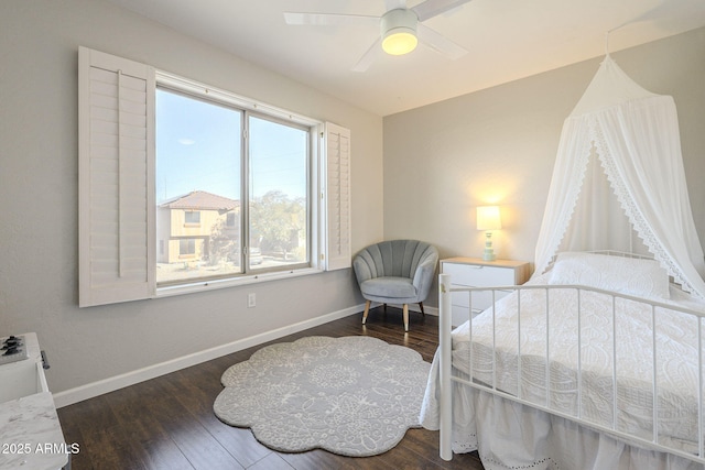 bedroom featuring ceiling fan and dark hardwood / wood-style flooring