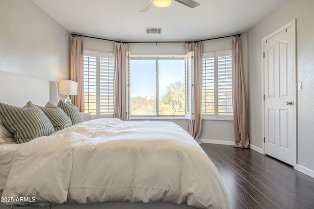 bedroom featuring ceiling fan and dark hardwood / wood-style floors