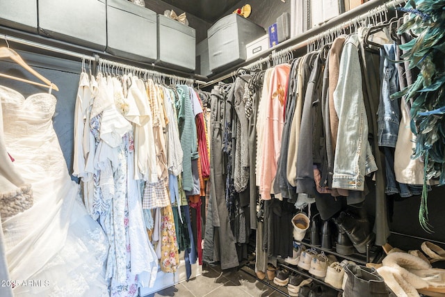 spacious closet featuring tile patterned flooring