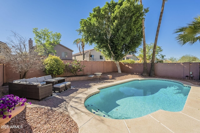 view of pool featuring a patio and an outdoor living space