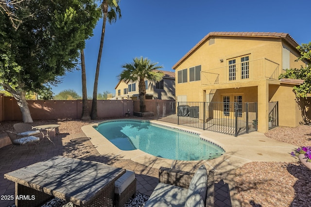 view of pool featuring a patio area