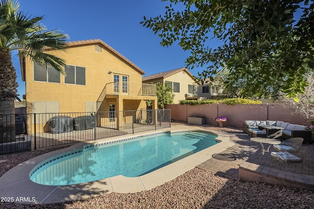 view of pool featuring a patio area and an outdoor living space