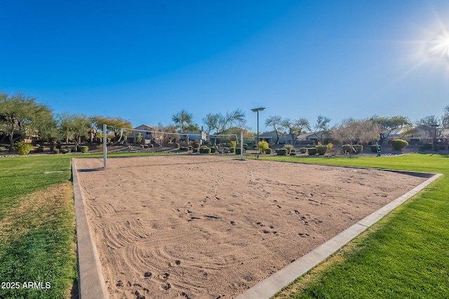 surrounding community featuring a yard and volleyball court