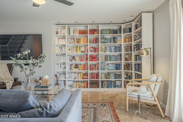 sitting room featuring ceiling fan