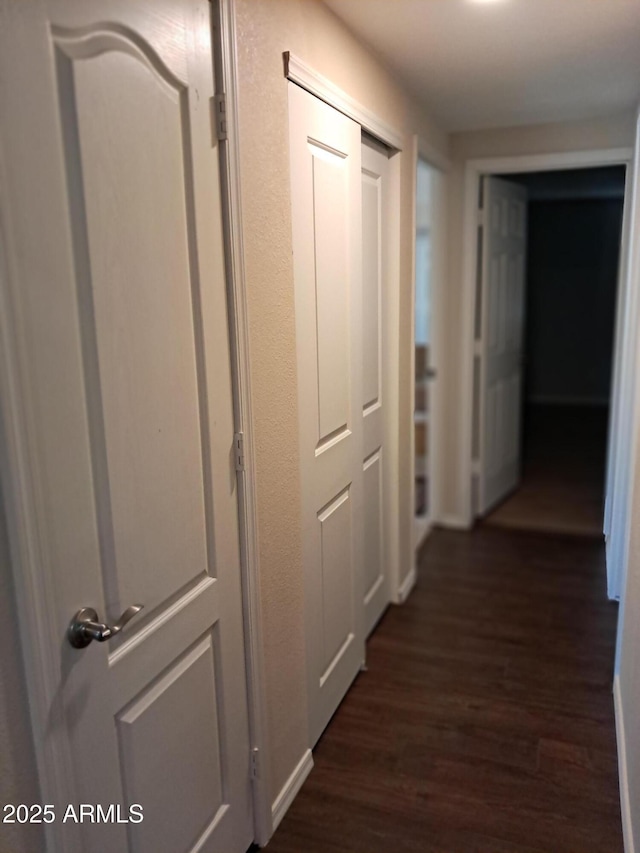 corridor featuring dark hardwood / wood-style floors