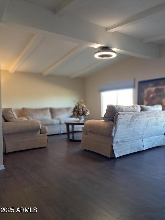 living room featuring lofted ceiling with beams and dark hardwood / wood-style floors