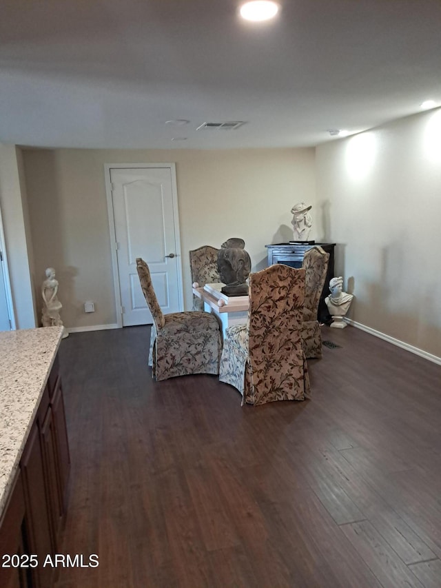 dining room featuring dark hardwood / wood-style flooring