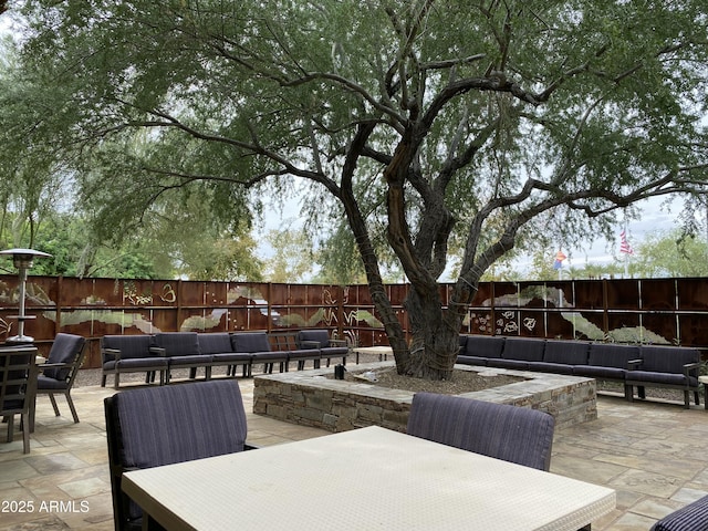 view of patio featuring outdoor dining area, an outdoor hangout area, and a fenced backyard