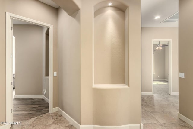 corridor featuring baseboards