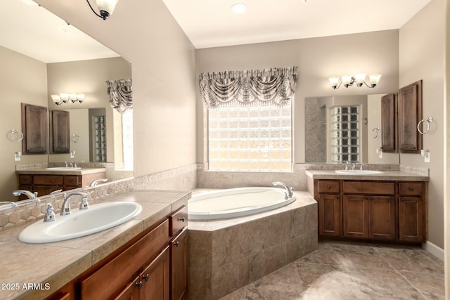 full bath with a bath and two vanities