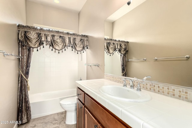bathroom featuring toilet, vanity, decorative backsplash, and  shower combination
