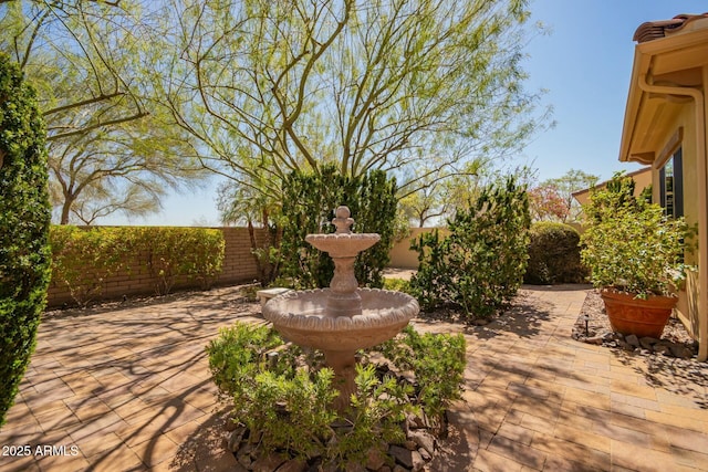 fenced backyard featuring a patio
