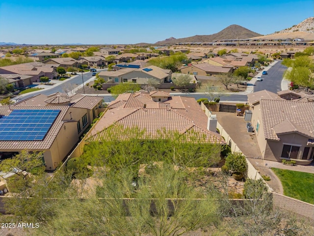 aerial view of residential area featuring mountains
