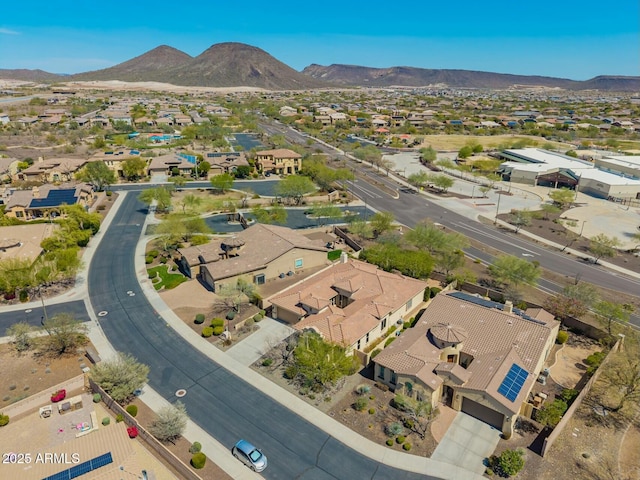 aerial view of residential area featuring a mountain backdrop