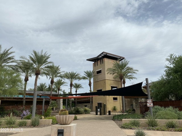 view of building exterior with fence