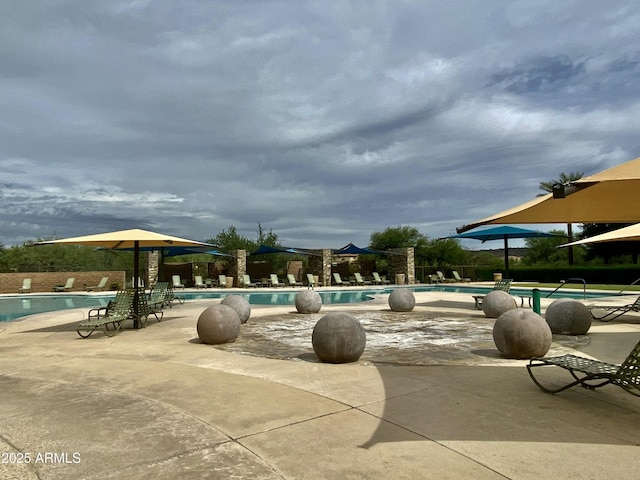 community pool with a patio