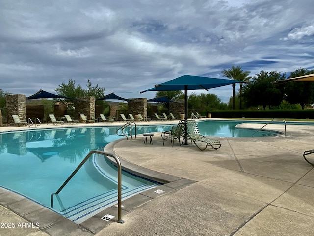 community pool with a patio