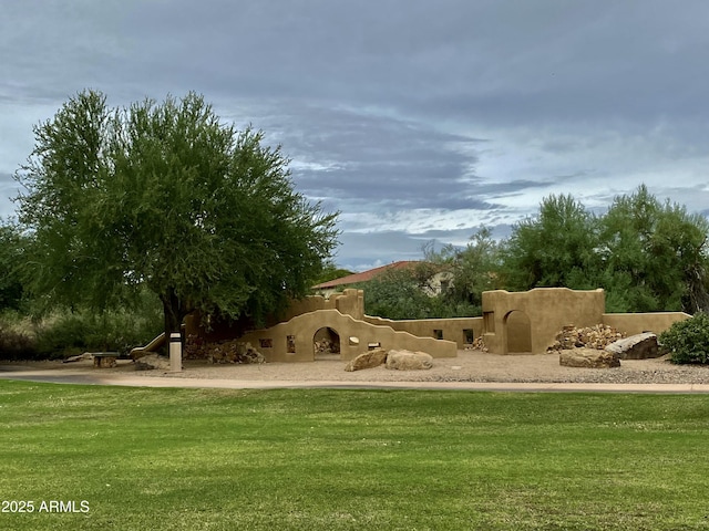 surrounding community featuring a yard