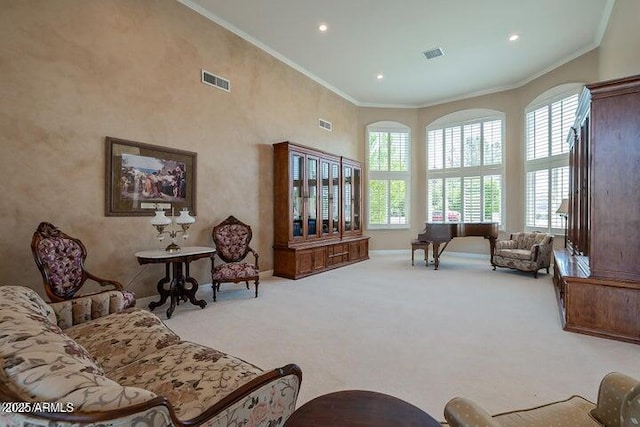 living room featuring crown molding, visible vents, and carpet floors