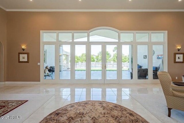 living room featuring arched walkways, marble finish floor, and crown molding